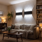 Two Aura Beam wall lights washing a living room wall with cool white light above a sofa and bookshelves