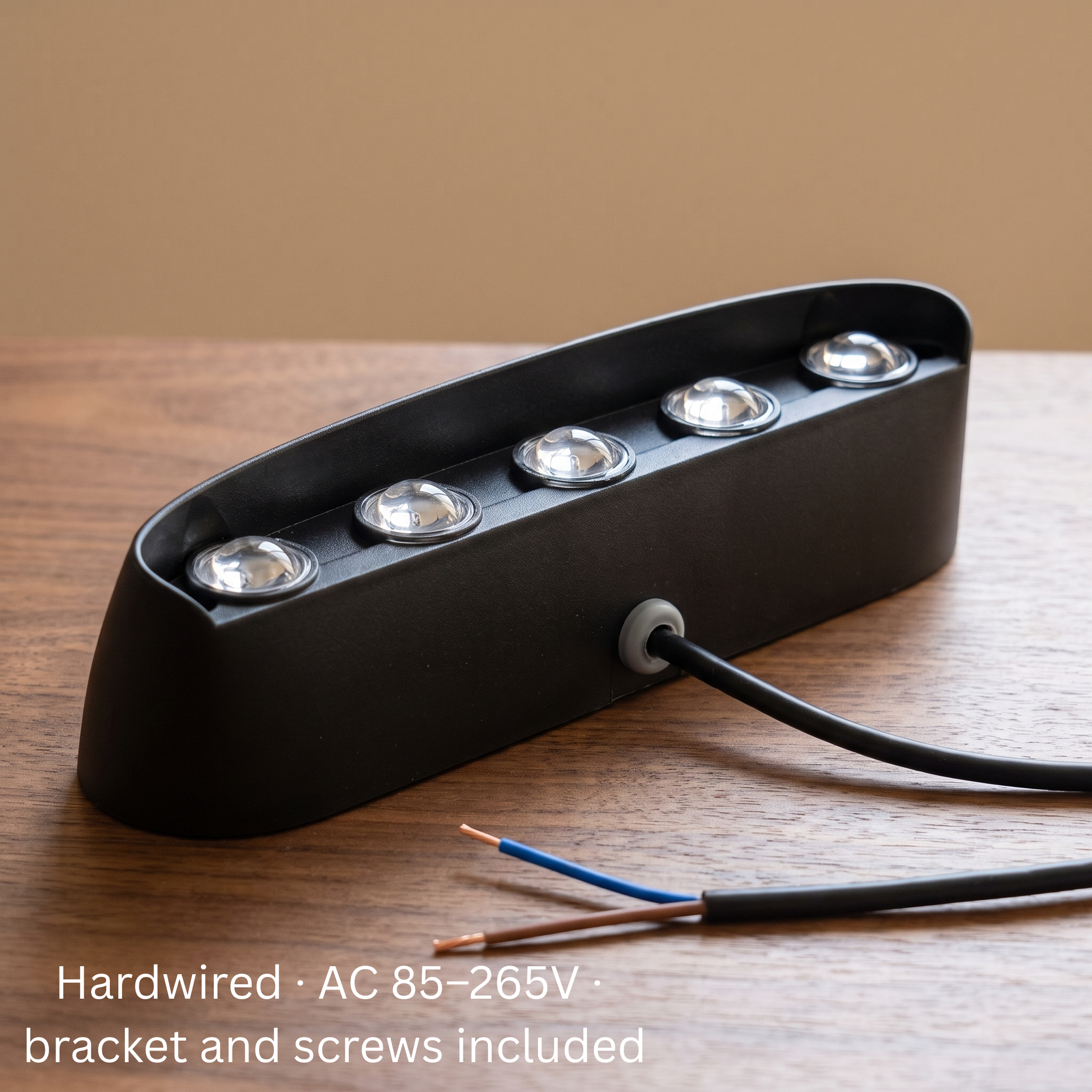 Aura Beam LED wall light on a table showing its hardwired AC 85-265V cable with mounting bracket and screws included