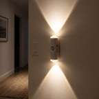 HaloBeam motion sensor wall light casting warm white up-and-down beams in a hallway