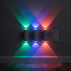 Three HaloBeam wall lights glowing green, blue and red on a wall in RGB colour mode