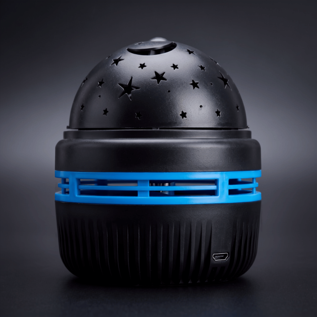 Starlull starry sky projector shown against a dark gradient, with its star-cut dome and blue banded base