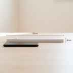 Nook Light motion sensor bar shown flat with its measurements, 30 cm long and 8 mm thick