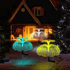 SeaBloom solar jellyfish garden lights glowing in multiple colours along a garden path at night