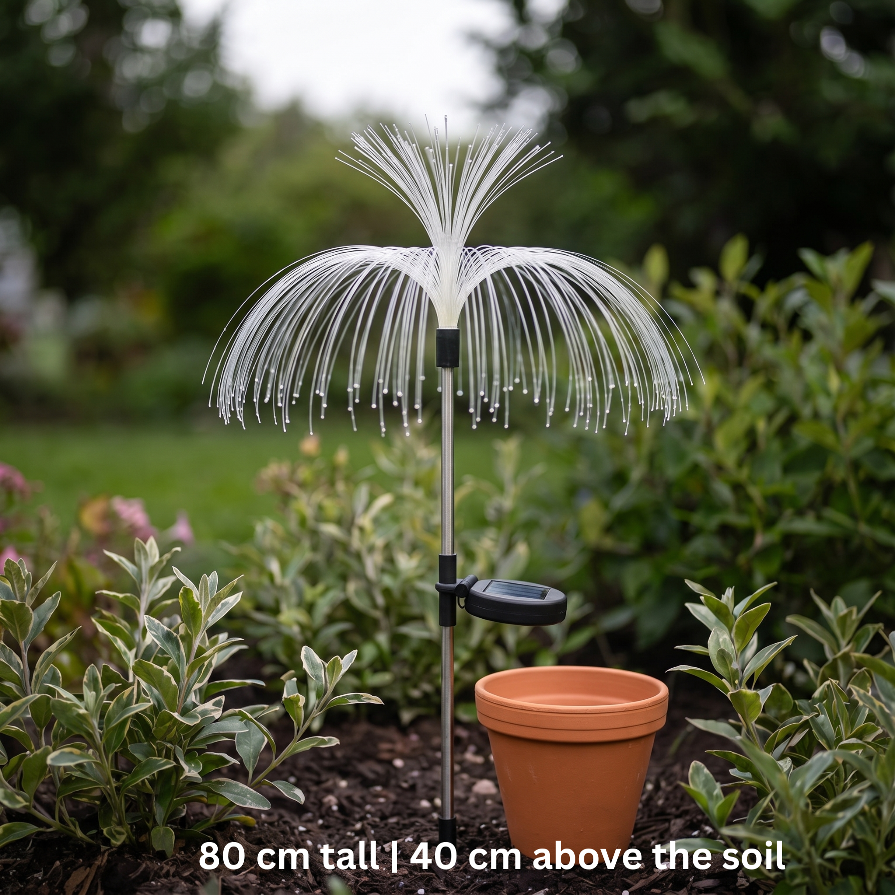 SeaBloom solar garden light switched off in daylight beside a terracotta pot, showing its 80 cm height and white fibre-optic head